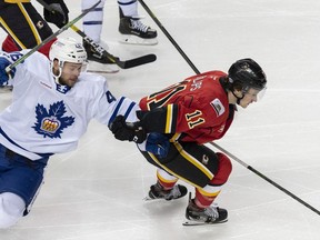 Stockton Heat sniper Matthew Phillips leaves the Toronto Marlies' Calle Rosen behind during a game at Scotiabank Saddledome this past Sunday.