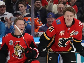 The Ottawa Senators' Brady Tkachuk chats with brother Matthew, of the Calgary Flames, during the 2020 NHL All-Star Skills Competition at Enterprise Center on Jan. 24, 2020, in St Louis.