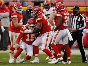 Chiefs quarterback Patrick Mahomes is assisted to his feet by offensive tackle Mike Remmers after a sack. Remmers will start at left tackle in the Super Bowl.