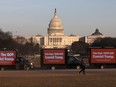 Trucks advertising in support of convicting former U.S President Donald Trump in his upcoming second impeachment trial are seen parked on the National Mall with the U.S. Capitol Building visible behind them in Washington, Feb. 8, 2021.