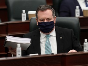 Premier Jason Kenney after Minister of Finance Travis Toews delivered the 2021 Alberta Provincial budget at the Alberta Legislature, in Edmonton Thursday Feb. 25, 2021.