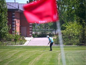 A golfer plays on the Richmond Green golf course.