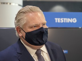 Ontario Premier Doug Ford tours the COVID-19 testing centre in Terminal 3 at Pearson Airport in Toronto on Wednesday, February 3, 2021.