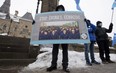 Protesters gather outside the Parliament buildings in Ottawa, Monday, February 22, 2021 ahead of the vote on an opposition motion calling on Canada to recognize China's actions against ethnic Muslim Uighurs as genocide.
