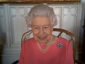 A handout screenshot released on February 25, 2021 by Buckingham Palace shows Britain's Queen Elizabeth II video call with four health officials leading the deployment of the Covid-19 vaccination in England, Scotland, Wales and Northern Ireland.