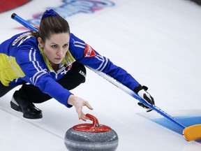 Team Alberta skip Laura Walker makes a shot against Team Northwest Territories at the Scotties Tournament of Hearts in Calgary on Tuesday.