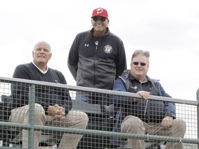 From left, Okotoks Dawgs vice-president William Gardner and managing director John Ircandia, and Western Canadian Baseball League president Kevin Kvame pose for a photo in the new Core 4 Corner seating area at Seaman Stadium in Okotoks on Sept. 2, 2020.