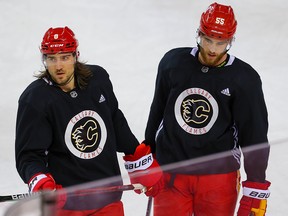 Calgary Flames defensive pair Chris Tanev, left, and Noah Hanifin.