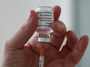 A healthcare worker fills a syringe with a dose of the Oxford-AstraZeneca COVID-19 vaccine at the Foch hospital in Suresnes, near Paris, France, February 8, 2021. REUTERS/Benoit Tessier ORG XMIT: GGG-BTE21