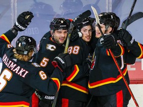 Feb 17, 2021; Calgary, Alberta, CAN; Calgary Flames left wing Andrew Mangiapane (88) celebrates his second period goal against the Vancouver Canucks with teammates at Scotiabank Saddledome. Mandatory Credit: Sergei Belski-USA TODAY Sports ORG XMIT: IMAGN-445168