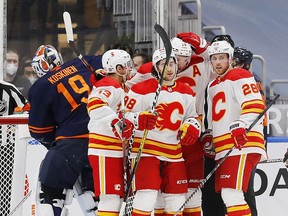 Feb 20, 2021; Edmonton, Alberta, CAN; The Calgary Flames celebrate a first period goal by forward Andrew Mangiapane (88) against there Edmonton Oilers at Rogers Place. Mandatory Credit: Perry Nelson-USA TODAY Sports ORG XMIT: IMAGN-445187