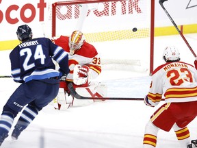 Winnipeg Jets defenceman Derek Forbort scores on Calgary Flames goaltender David Rittich at Bell MTS Place in Winnipeg on Tuesday, Feb. 2, 2021.