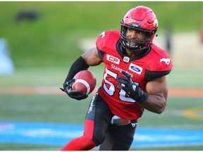 Calgary Stampeders linebacker Jameer Thurman runs the ball after an interception against the BC Lions during CFL action at McMahon Stadium in Calgary Sept. 16, 2017.