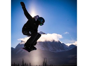 A snowboarder takes to the air at Lake Louise ski area west of Calgary. The resort's weekend forecast is calling for  warmer temperatures.