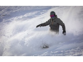 A snowboarder enjoys the excellent conditions last Monday in Paradise Bowl at Lake Louise ski resort west of Calgary.