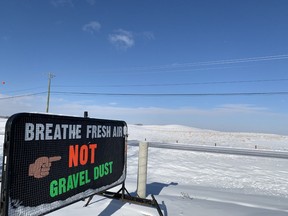 A sign on a property on Burma Rd. just outside Calgary's city limits points to the proposed site of a massive gravel pit metres away in Rocky View County. Feb. 3, 2021.