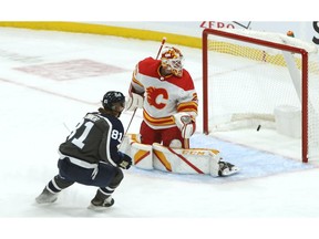 Jets forward Kyle Connor beats Calgary Flames goaltender Jacob Markstrom for a goal in Winnipeg on Thursday.