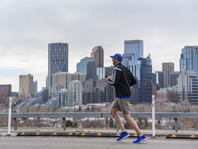A jogger moves along the pathway in Crescent Heights on Sunday, March 7, 2021.