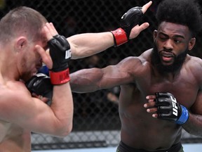 Aljamain Sterling punches Petr Yan of Russia in their UFC bantamweight championship fight during the UFC 259 event at UFC APEX on March 06, 2021 in Las Vegas, Nevada.