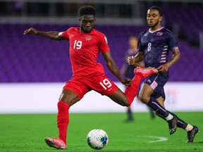 Alphonso Davies of Canada plays the ball against Bermuda during a CONCACAF World Cup qualifying game in Orlando, Fla., on March 25, 2021.