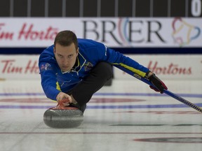Team Alberta skip Brendan Bottcher, of Edmonton, delivers his stone in Draw 2 against Manitoba on Saturday at the Brier.