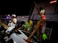 Women dance on top of a car as revellers enjoy spring break festivities despite an 8pm curfew imposed by local authorities, amid the COVID-19 pandemic, in Miami Beach, Fla., March 20, 2021.