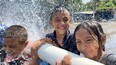 Children enjoying fresh water from a new well drill in Guatemala.