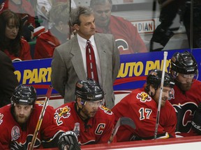 MAY 29, 2004 - Sporting a Red Mile tie, Calgary Flames coach Darryl Sutter watches the action during the third period during game 3 of the 2004 Stanley Cup Finals versus the Tampa Bay Lightning.