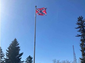 A Confederate flag was hoisted above military tombstones at Calgary’s Union Cemetery Tuesday.