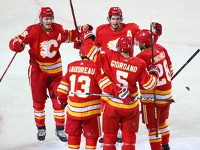 The Calgary Flames celebrate Mark Giordano’s goal against the Winnipeg Jets at the Saddledome in Calgary on Saturday, March 27, 2021. 
Gavin Young/Postmedia