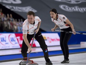 Calgary Ab,March 25, 2021.WinSport Arena at Calgary Olympic Park.Home Hardware Canadian Mixed Double Curling Championship.Kerry Einarson of Gimli MB, and Brad Gushue of St.John's NL, during the final game against team Kadriana Sahaidak and Colton Lott of Winnipeg Beach Mb.Curling Canada/ Michael Burns Photo