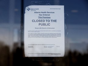 An Alberta Health Services closure order is visible posted on the front door of GraceLife Church, in Spruce Grove Friday March 5, 2021. GraceLife church Pastor James Coates lost an appeal of his bail conditions on Friday. Coates has been jailed in the Edmonton Remand Centre for the past two weeks after continuing to hold worship services without face masks, capacity limits, or physical distancing.