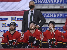 Calgary Flames head coach Darryl Sutter looks at the scoreboard after another Oilers goal at the Saddledome on Wednesday, March 17, 2021.