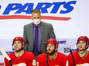 Feb 19, 2021; Calgary, Alberta, CAN; Calgary Flames head coach Geoff Ward on his bench against the Edmonton Oilers during the second period at Scotiabank Saddledome. Mandatory Credit: Sergei Belski-USA TODAY Sports ORG XMIT: IMAGN-445181