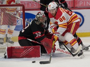 Calgary Flames forward Andrew Mangiapane moves in for a shot against Ottawa Senators goalie Filip Gustavsson at the Canadian Tire Centre in Ottawa on Monday, March 22, 2021.