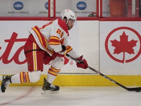 Calgary Flames forward Dillon Dube skates with the puck against the Ottawa Senators at the Canadian Tire Centre in Ottawa on Monday, March 22, 2021.
