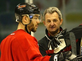 ***From Calgary*** Jarome Iginla, and coach, Darryl Sutter, chat during practice at the dome.ADSDARREN MAKOWICHUK PIC Original Filename was 20040523chat_dm002.jpg-1 Processed: Sunday, May 23, 2004 6:23:00 PM ORG XMIT: iggy270