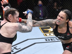 Amanda Nunes of Brazil punches Megan Anderson of Australia in their UFC featherweight championship fight during the UFC 259 event at UFC APEX on March 06, 2021 in Las Vegas, Nevada.