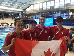 U of C swimmers (from left) Marit Anderson, Rob Hill, Peter Brothers and Anders Kline at the FISU Games in Italy 2019.