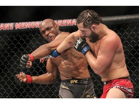 Kamaru Usman (left) fights Jorge Masvidal during the welterweight title bout of UFC 261 at VyStar Veterans Memorial Arena on April 25, 2021, in Jacksonville, Fla.