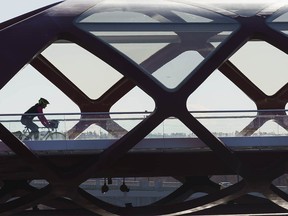 A cyclist crosses the Peace Bridge in Calgary on Thursday, April 15, 2021.