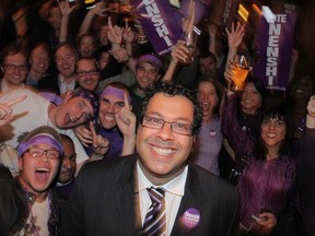 Naheed Nenshi poses for pictures with supporters as they watch the election results come in at a local bar in Calgary, Alberta, on Oct. 18, 2010.