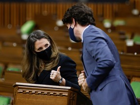 Canada's Finance Minister Chrystia Freeland gives a thumbs up to Prime Minister Justin Trudeau in the House of Commons on Parliament Hill in Ottawa, Ontario, Canada, April 19, 2021.