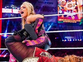 Natalya locks Nia Jax in the Sharpshooter!