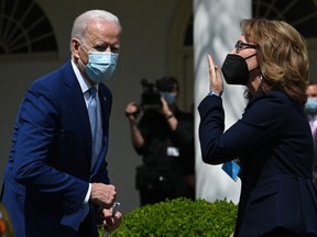 U.S. President Joe Biden walks torwards former U.S. Representative Gabby Giffords after he spoke about gun violence prevention in the Rose Garden of the White House in Washington, D.C., on April 8, 2021.