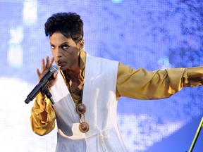 Prince performs on stage at the Stade de France in Saint-Denis, outside Paris, on June 30, 2011.