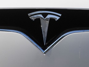 This file photo taken on Sept. 5, 2020 shows a Tesla logo on a Model Y car during its presentation at the Automobile Club in Budapest.