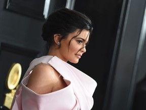 (FILES) In this file photo taken on February 10, 2019 TV personality Kylie Jenner arrives for the 61st Annual Grammy Awards in Los Angeles. - Beauty products giant Coty announced on November 18, 2019 a deal to take a majority stake in Kylie Jenner's cosmetics and skincare company, marrying Jenner's celebrity prominence with Coty's distribution and commercial prowess. Under the transaction, Coty, whose brands include Hugo Boss and Burberry fragrances, will pay $500 million for a 51 percent stake in Jenner's company. Jenner is the youngest daughter of Kris Jenner and Caitlyn Jenner, formerly known as Bruce Jenner. (Photo by VALERIE MACON / AFP)