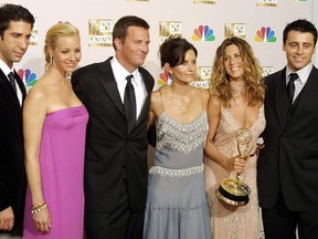 In this file photo taken on September 21, 2002 cast members from "Friends," which won Outstanding Comedy, series pose for photogarpher at the 54th Annual Emmy Awards at the Shrine Auditorium in Los Angeles . From L to R are David Schwimmer, Lisa Kudrow, Mathew Perry, Courtney Cox Arquette, Jennifer Aniston and Matt LeBlanc.