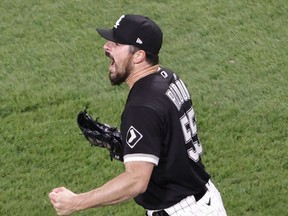 Apr 14, 2021; Chicago, Illinois, USA; Chicago White Sox starting pitcher Carlos Rodon (55) reacts after delivering a final out against the Cleveland Indians during the ninth inning at Guaranteed Rate Field. Mandatory Credit: Kamil Krzaczynski-USA TODAY Sports ORG XMIT: IMAGN-431829